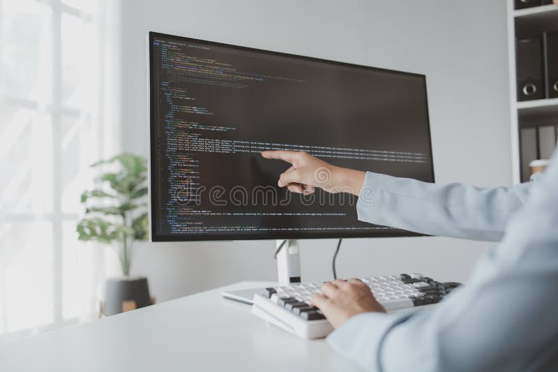 Female programmer typing on computer keyboard, programmer designing custom computer programming, coding programs and websites. Computer programming design concepts.