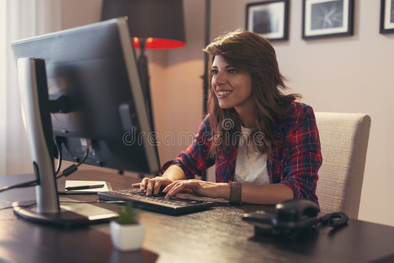 Female programmer working in a home office royalty free stock photos