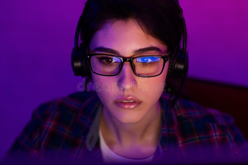 Female programmer working on laptop late at night stock photos