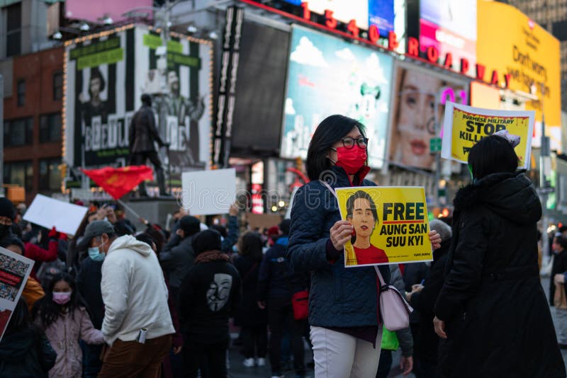 Female Protestor Holding A Sign At Times Square In New York City During A Myanmar Protest 