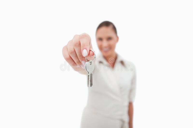 Female real estate agent holding keys royalty free stock photography