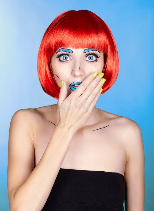 Female in red wig and in comic pop art make-up style on blue background