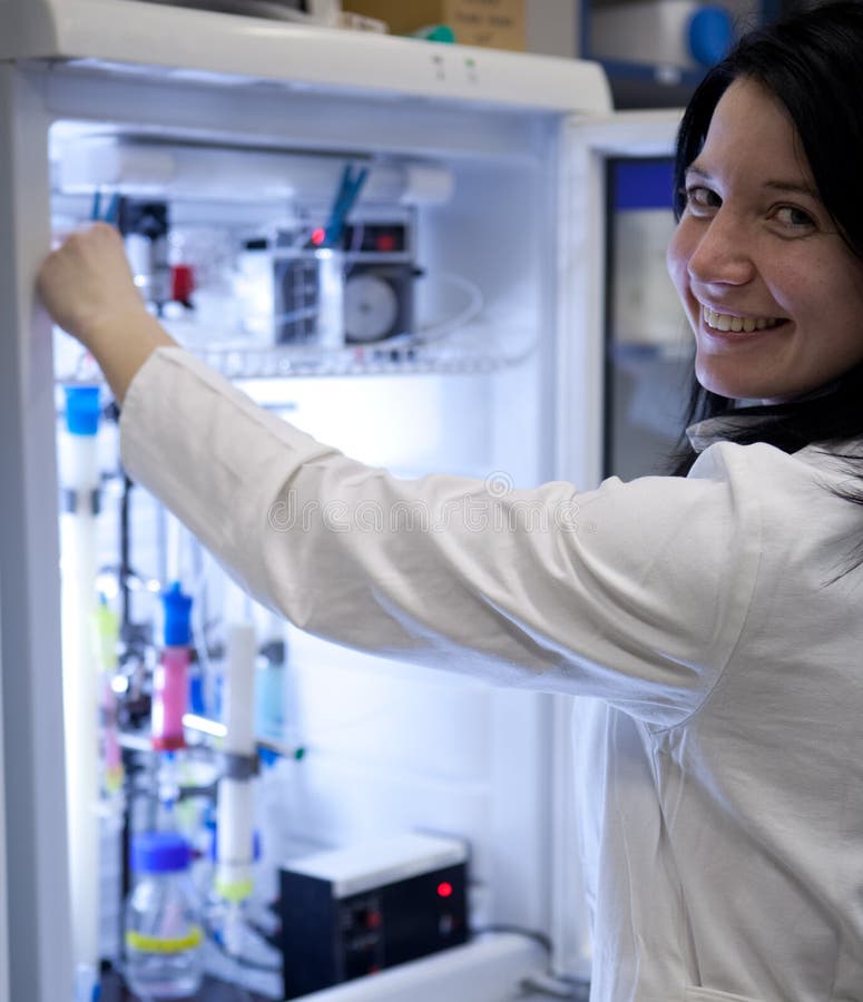 Female researcher carrying out experiment