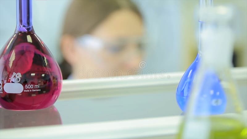 Female researchers carrying out research together in a chemistry lab research center color toned image shallow DOF royalty free stock images