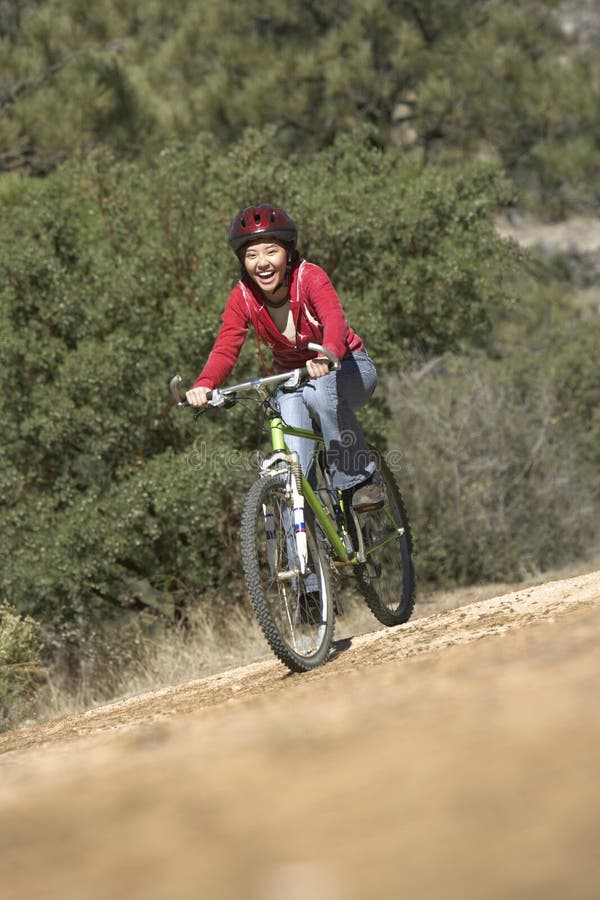 Female Riding Bicycle on Dirt Road Stock Image Image of adult