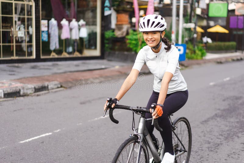 Female Riding a Road Bike in the City Street Stock Photo - Image of ...