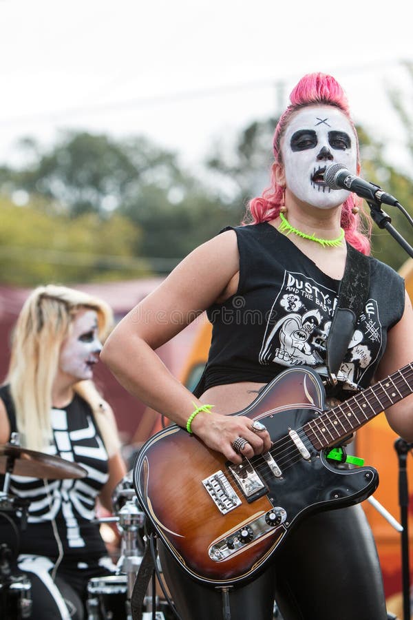 Female Rock Band Wearing Zombie Makeup Performs At Halloween Event royalty free stock image Female Rock Band Wearing Zombie Makeup Performs At Halloween Event royalty free stock image