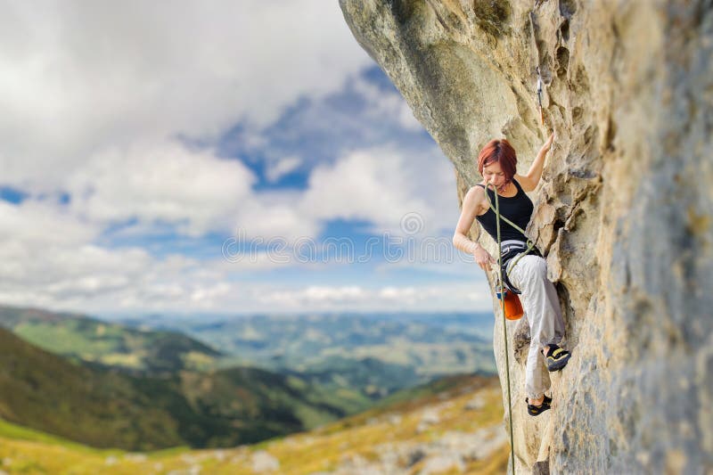 Female Rock Climber on Steep Overhanging Rock Cliff Stock Image - Image ...