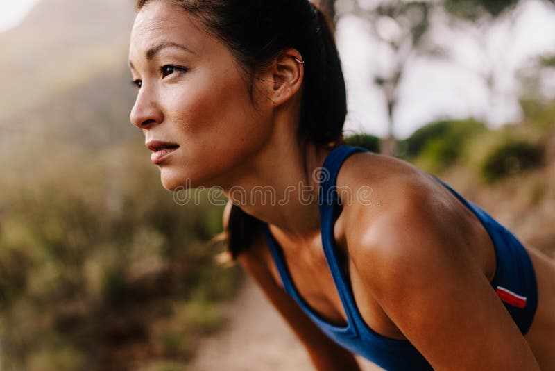 Female runner in sportswear taking a break stock photography Female runner in sportswear taking a break stock photography