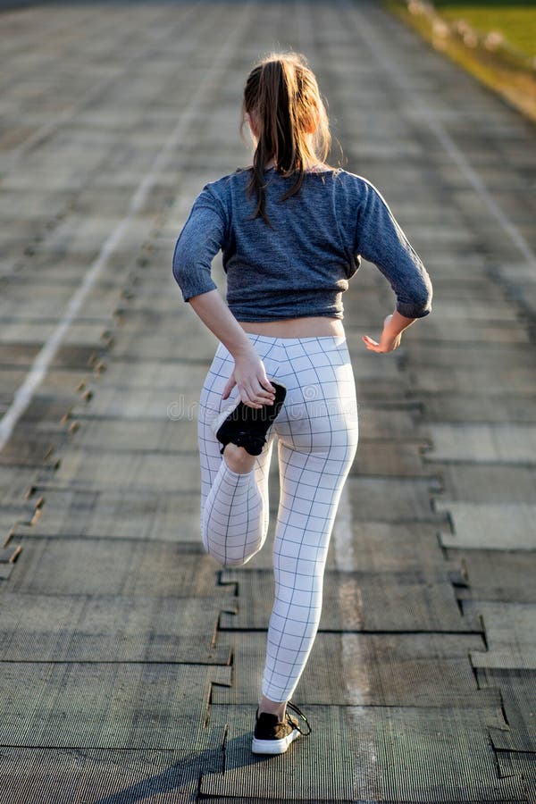 Female Runner Stretching Legs on Running Track Stock Photo Image of