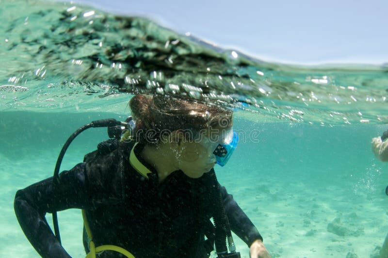 Female scuba diver on the surface