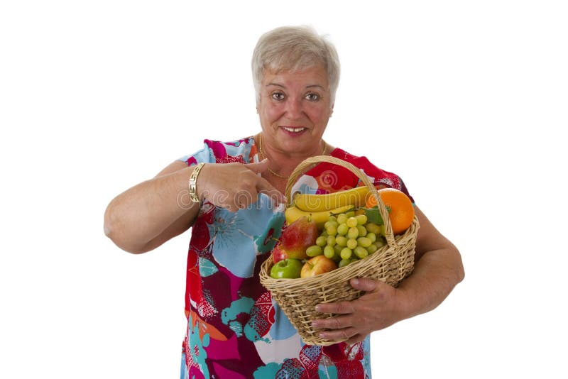 Female senior holding fruit basket stock image Female senior holding fruit basket stock image
