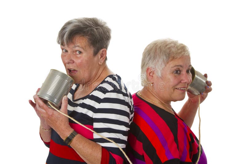 Female senior talking with can telephone