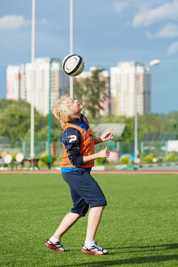 Female soccer player warms up before match stock photos Female soccer player warms up before match stock photos