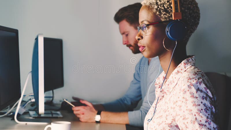 Female software developer working for IT company stock photo