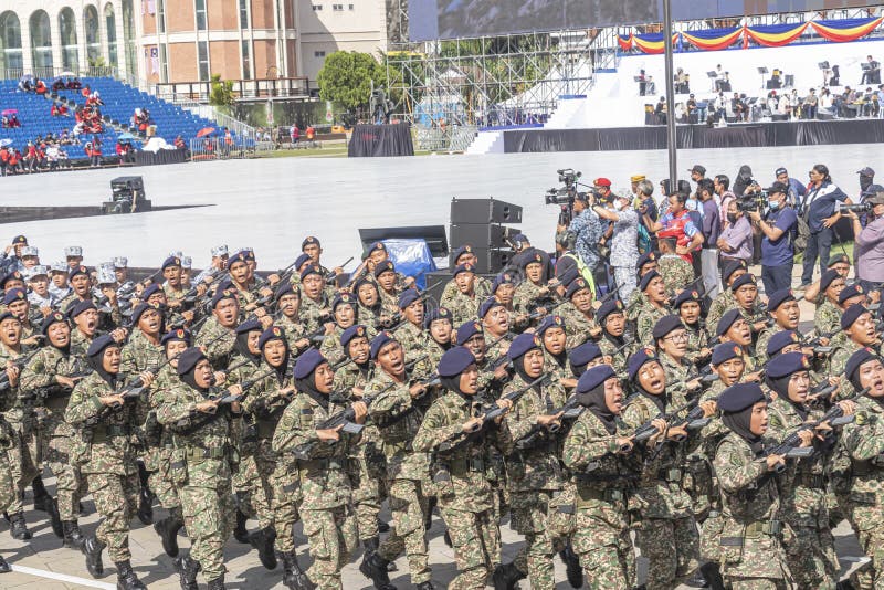 Female soldier of Malaysian Army marching during 65th Malaysia National Day Parade.