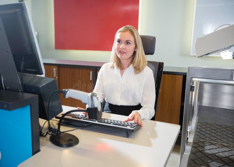 Female Staff Using Computer at Airport Checkin Stock Photo Image of person, security 100625298