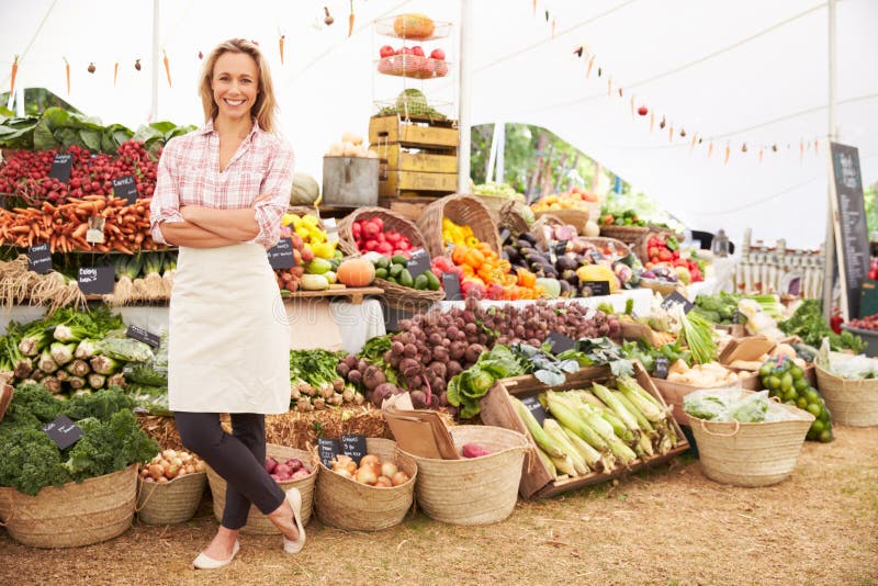 Female Stall Holder At Farmers Fresh Food Market royalty free stock image Female Stall Holder At Farmers Fresh Food Market royalty free stock image