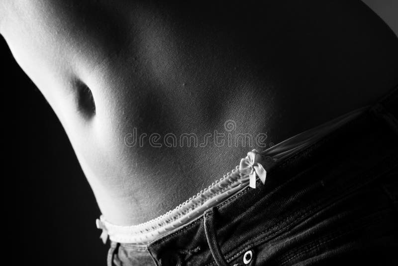 Female Stomach and Pantie with Ribbon and Jeans - Black and White Stock ...