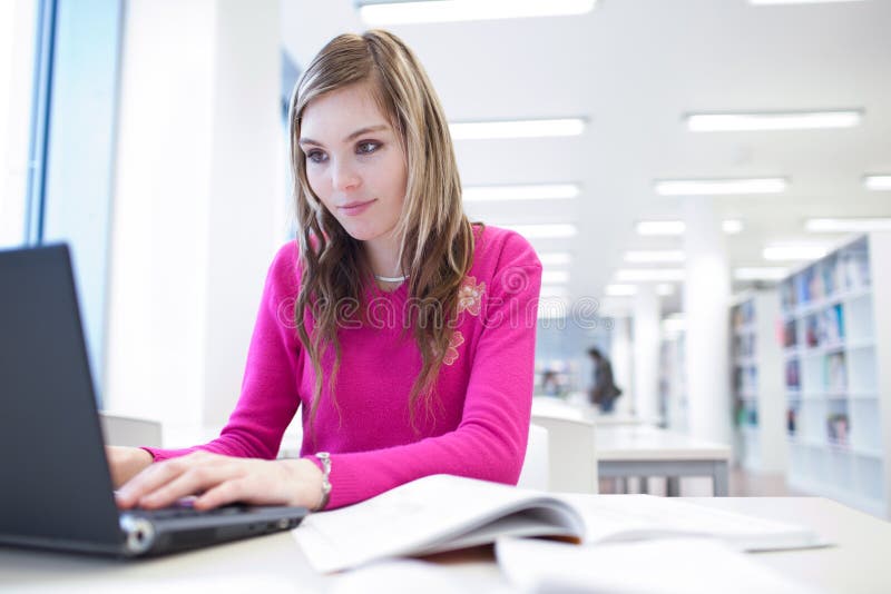 Female student with laptop and books