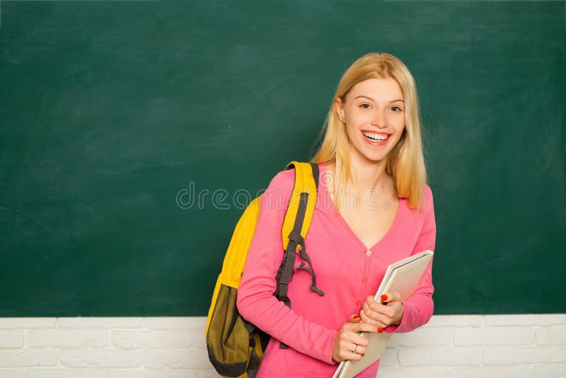 Female student laughing, preparing university creative research project. Ready to start an educational year. Happy royalty free stock photography Female student laughing, preparing university creative research project. Ready to start an educational year. Happy royalty free stock photography