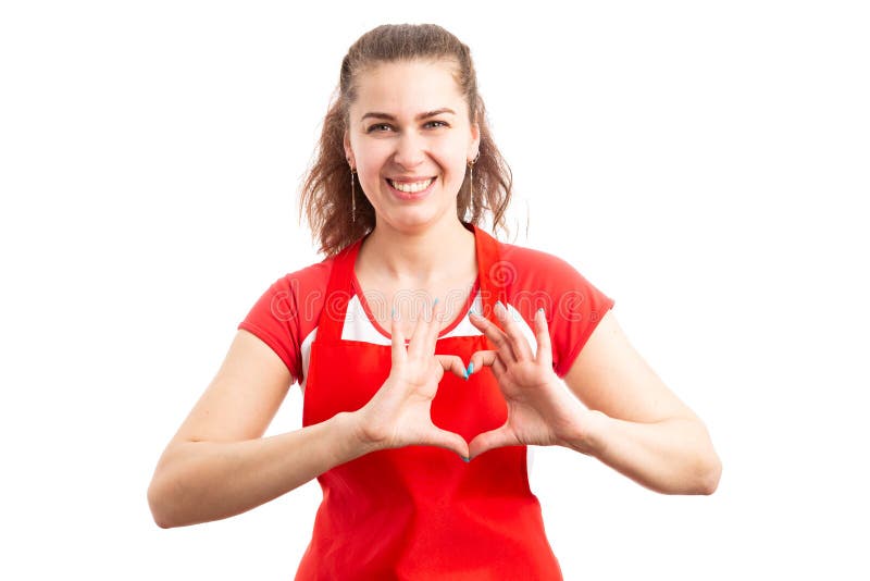 Female supermarket worker or employee showing love gesture