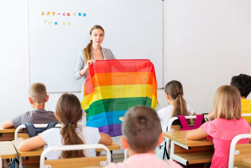 Female teacher discussing with preteen children about LGBT