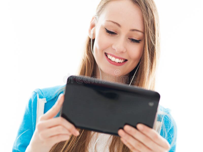 Female teenager using digital tablet stock image