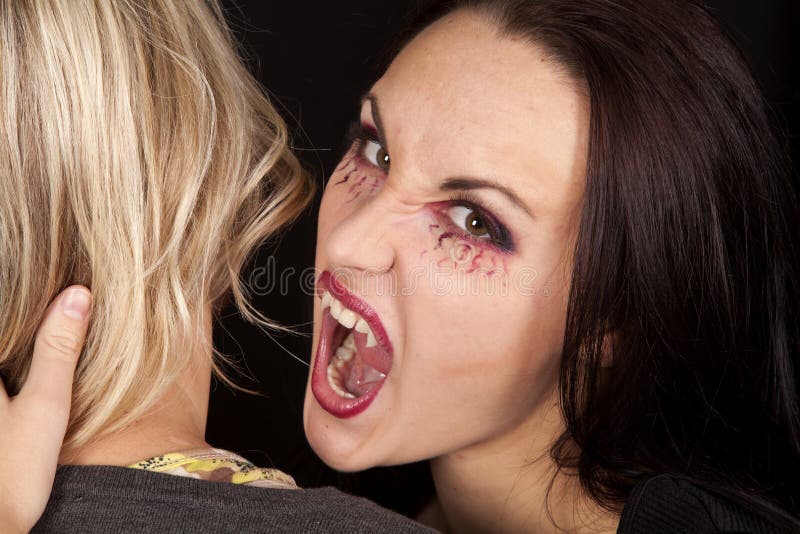 Female vampire bite womans neck looking. 