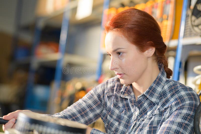 Female warehouse worker using digital equipment in warehouse royalty free stock image Female warehouse worker using digital equipment in warehouse royalty free stock image