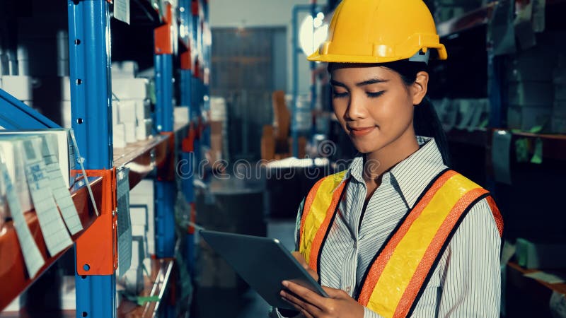 Female warehouse worker working at the storehouse . Logistics , supply chain and warehouse business concept .