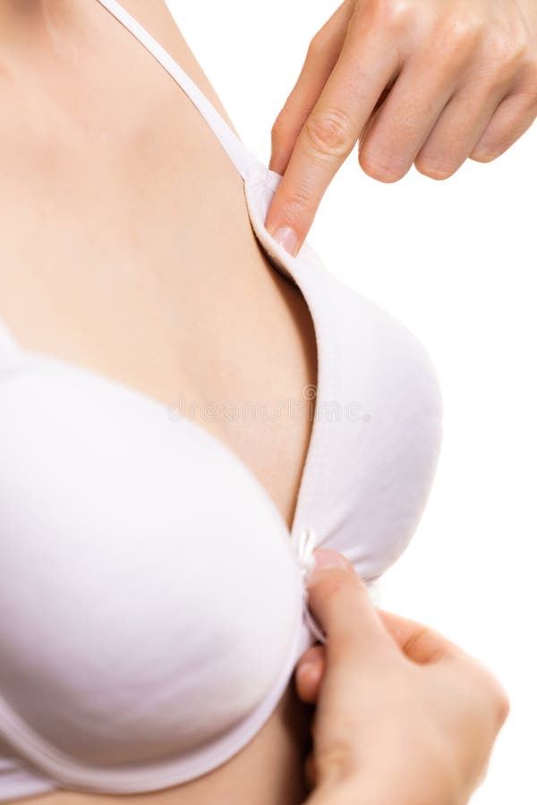 Woman small boobs puts big fruit in her bra Stock Photo