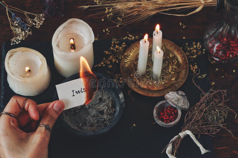 Female Wiccan Witch Holding a Burning Peace of Paper in Her Hand. White  Paper with Words `I Wish` Written on it Stock Photo - Image of atmosphere,  items: 192257008