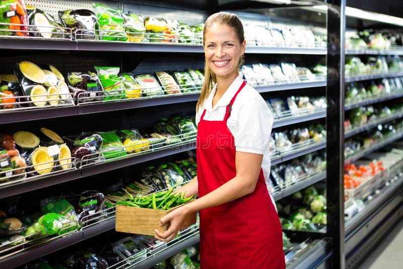 Female worker carrying vegetables box