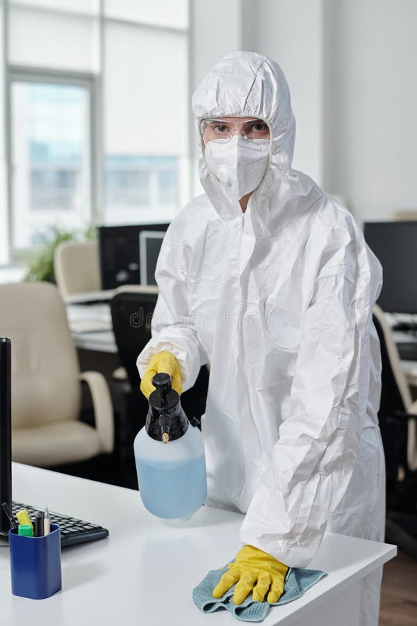 Female Worker of Cleaning Service in Protective Workwear Disinfecting