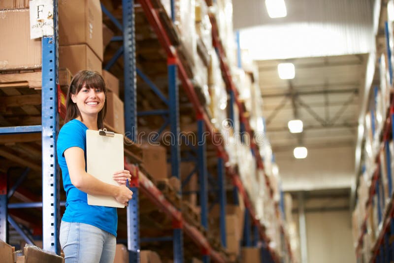 Female Worker In Distribution Warehouse royalty free stock photos Female Worker In Distribution Warehouse royalty free stock photos