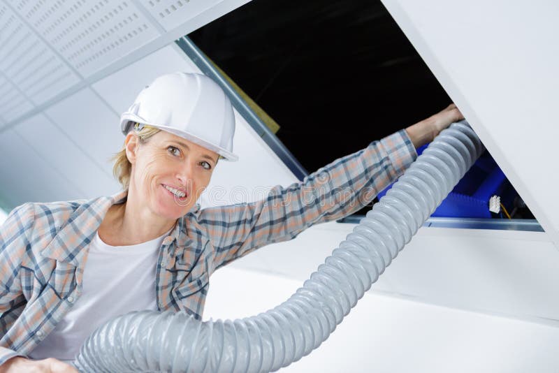 Worker with Ventilation System Pipes Stock Image Image of technician