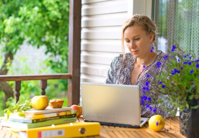 a freelance copywriter typing a checklist on her laptop