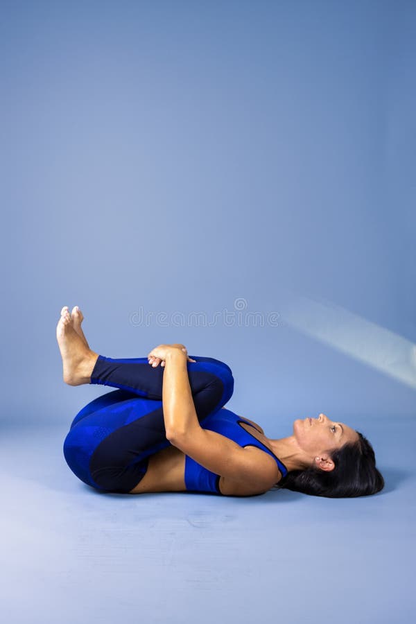 Female Yoga Instructor Does Floor Exercises In Gym Clothes Stock Image Image Of Adult