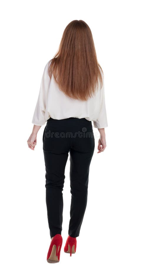 Femeie de afaceri cu capete roșii în mișcare. stock image