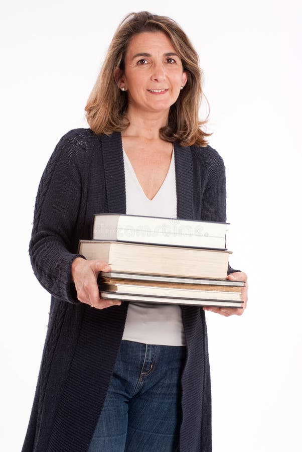 Femme avec la pile des livres photographie stock Femme avec la pile des livres photographie stock