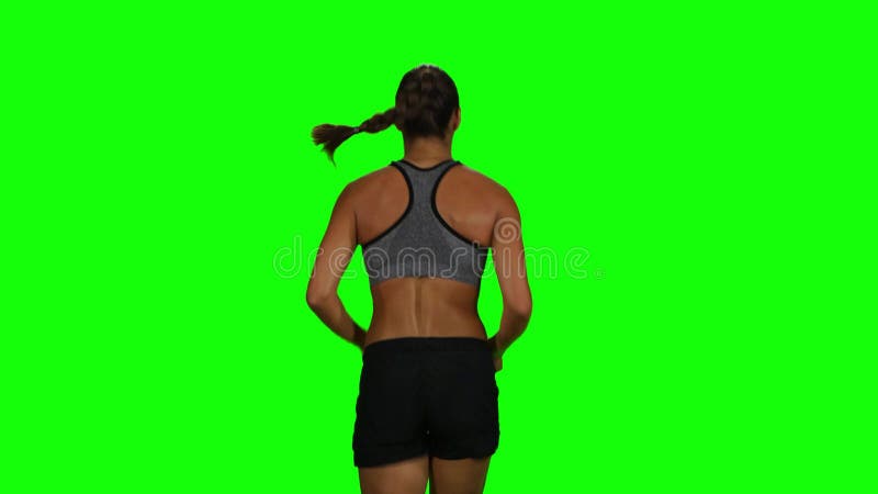 Femme convenable et musculaire pulsant Vue arrière Écran vert banque de vidéos