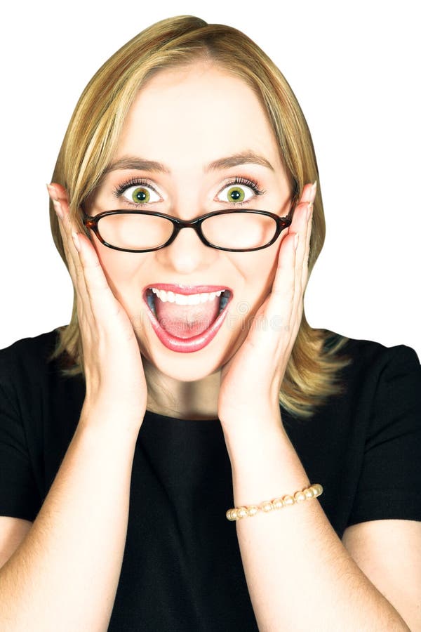 Young blond woman with large green eyes in glasses holding her head in her hands and screaming with joy. Young blond woman with large green eyes in glasses holding her head in her hands and screaming with joy