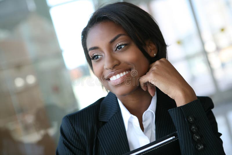 A pretty african american business woman at her company. A pretty african american business woman at her company