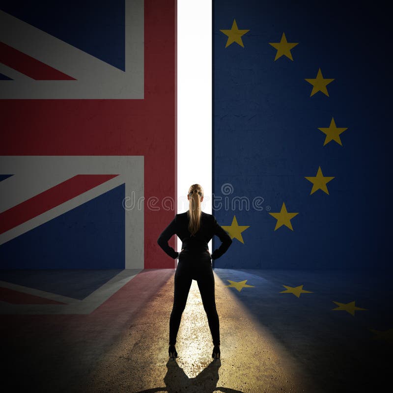 Businesswoman standing in front of a wall with the union jack and the eu flag and a portal. Businesswoman standing in front of a wall with the union jack and the eu flag and a portal