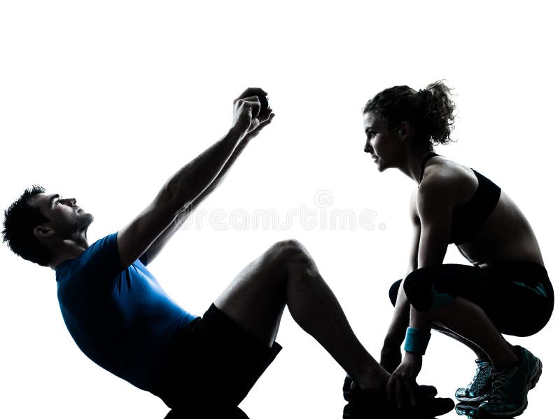 Femme d'homme exerçant la forme physique abdominale de séance d'entraînement image stock Femme d'homme exerçant la forme physique abdominale de séance d'entraînement image stock