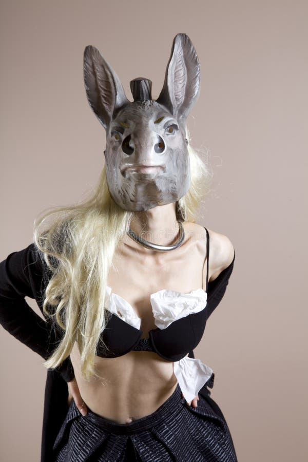 Parody of the blond girl`s the stereotype Blond Donkey woman wearing a black bra with toilet paper inside to increase in volume. Parody of the blond girl`s the stereotype Blond Donkey woman wearing a black bra with toilet paper inside to increase in volume