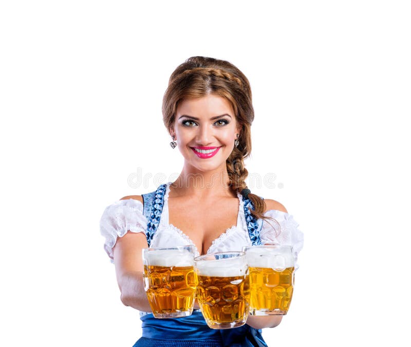 Femme dans la robe bavaroise traditionnelle tenant des tasses de bière photos stock Femme dans la robe bavaroise traditionnelle tenant des tasses de bière photos stock