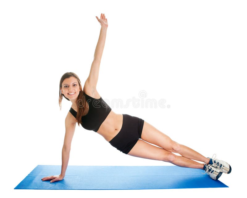 Femme de forme physique faisant l'aérobic sur le couvre-tapis de gymnastique photos stock Femme de forme physique faisant l'aérobic sur le couvre-tapis de gymnastique photos stock