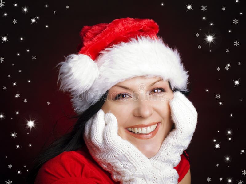 Femme de Noël dans le capuchon de Santa avec des étoiles image libre de droits Femme de Noël dans le capuchon de Santa avec des étoiles image libre de droits
